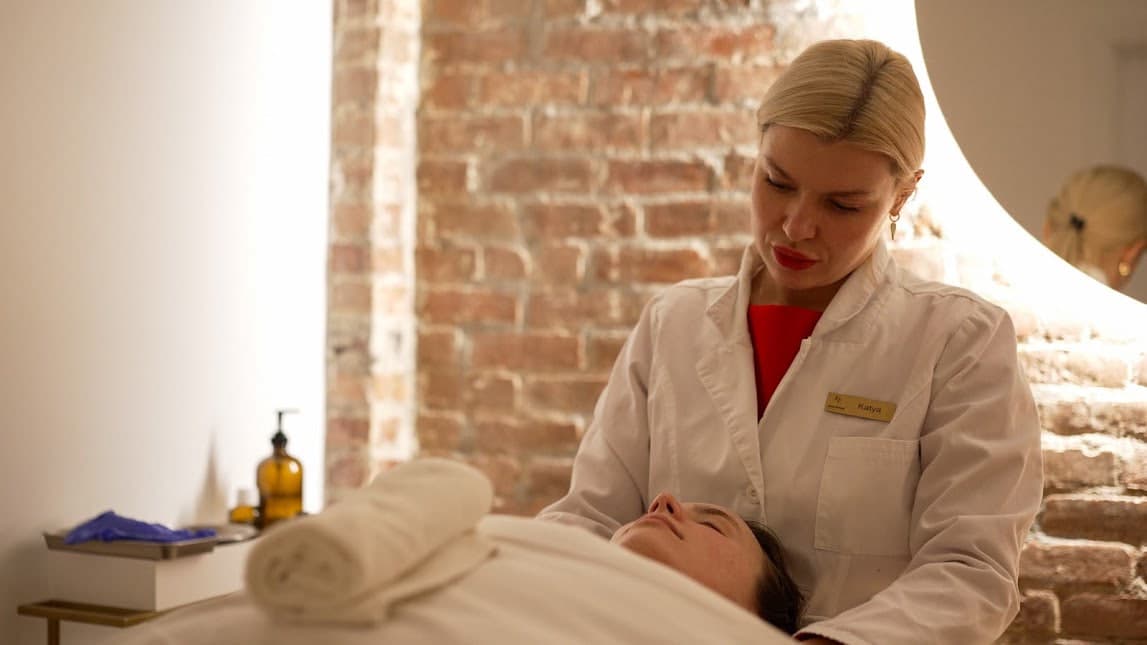 Katya with a client in the treatment room